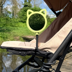 green cat shaped mirror attached to a stroller