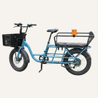 Blue cargo bike with a basket and seat on a white background with a mounted orange snack cup