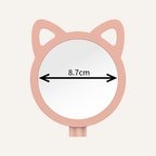 Cat ear mirror with measurement label on a beige background