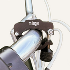 Close-up of a bicycle mount with 'mingo' branding on a white background