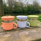 three colorful snack cups with a natural background